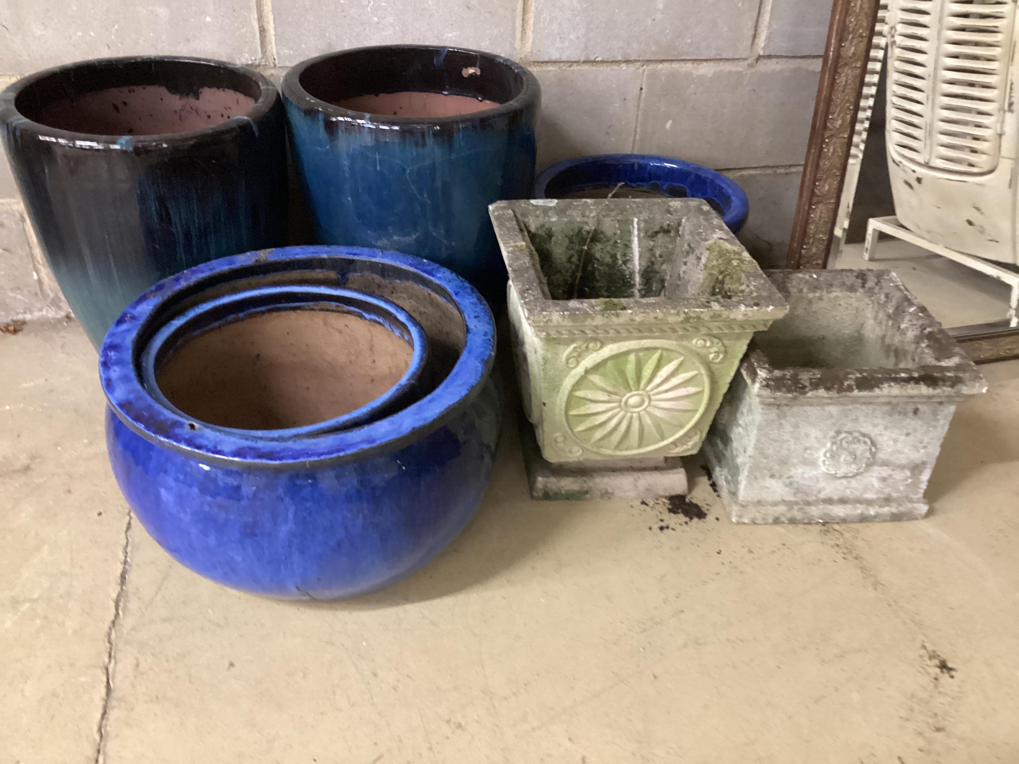 Seven assorted glazed earthenware and reconstituted stone garden planters, largest diameter 40cm, height 50cm
